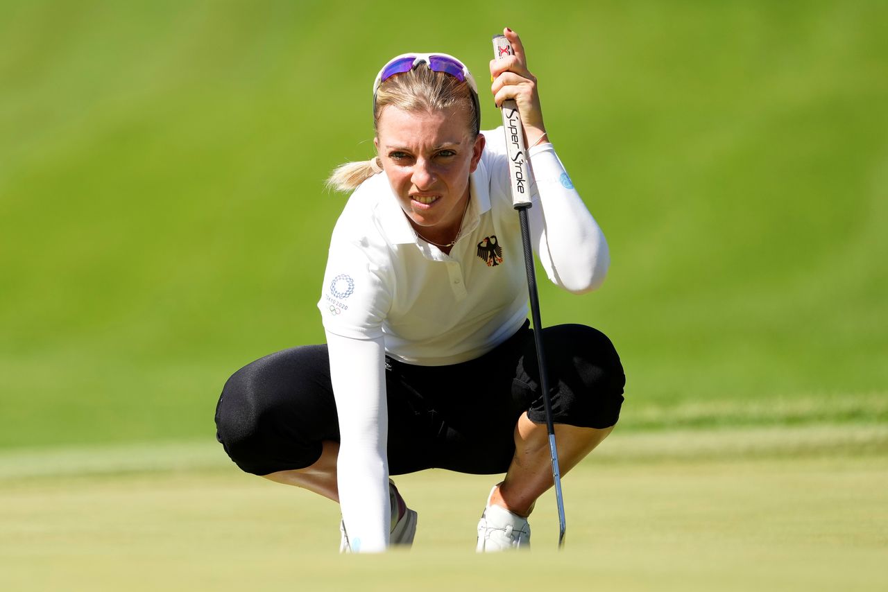 FILE PHOTO: Aug 5, 2021; Tokyo, Japan; Sophia Popov (GER) prepares to putt on the fourth green during the second round of the women