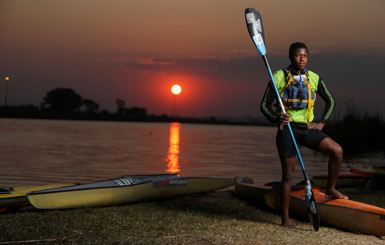 Twenty-year-old Benjamin Mntonintshi, a member of the Soweto Canoe and Recreation Club, poses for a photograph at the Orlando Dam in Soweto, South Africa, August 17, 2021. REUTERS/Siphiwe Sibeko