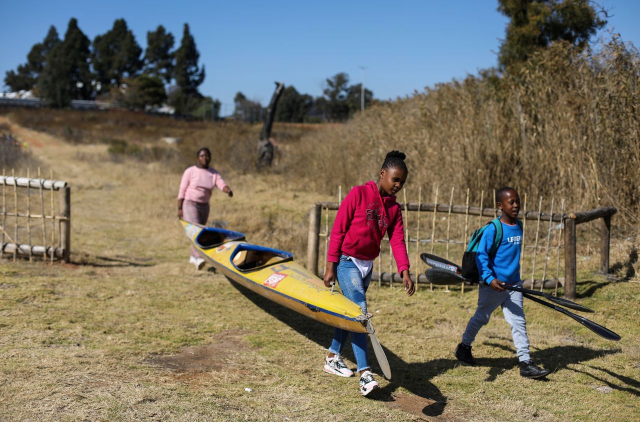 Canoeists arrive for training at the Orlando Dam in Soweto, South Africa, June 12, 2021. Picture taken June 12, 2021.  REUTERS/Siphiwe Sibeko