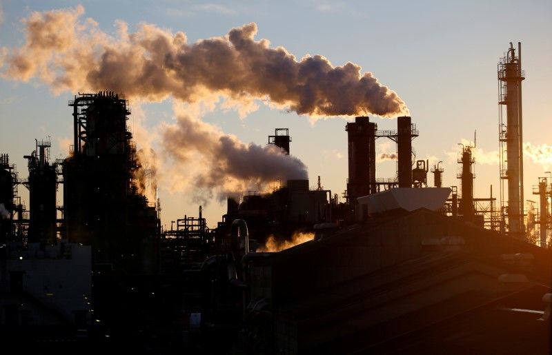 FILE PHOTO: Smoke rises from a factory in front of Mount Fuji during the sunset at Keihin industrial zone in Kawasaki, Japan January 16, 2017. REUTERS/Toru Hanai/File Photo