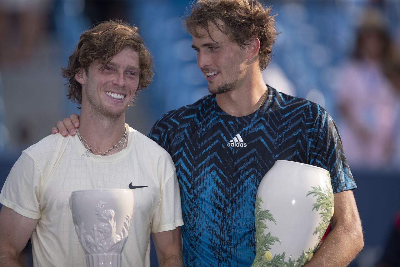 Aug 22, 2021; Mason, OH, USA; Alexander Zverev (GER) poses with Andrey Rublev (RUS) at the trophy presentation after the final during the Western and Southern Open final at the Lindner Family Tennis Center. Mandatory Credit: Susan Mullane-USA TODAY Sports