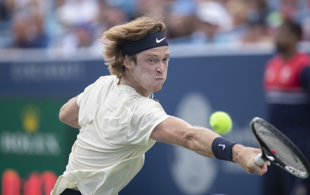 Aug 22, 2021; Mason, OH, USA; Andrey Rublev (RUS) returns the ball during his match against Alexander Zverev (GER not pictured) in the final during the Western and Southern Open final at the Lindner Family Tennis Center. Mandatory Credit: Susan Mullane-USA TODAY Sports