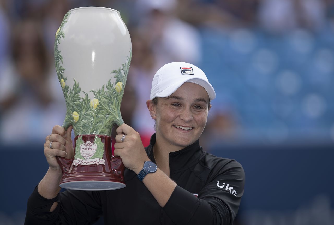 Aug 22, 2021; Mason, OH, USA; Ashleigh Barty (AUS) poses with the Rookwood Cup after winning her match Jil Teichmann (SUI not pictured) during the Western and Southern Open final at the Lindner Family Tennis Center. Mandatory Credit: Susan Mullane-USA TODAY Sports