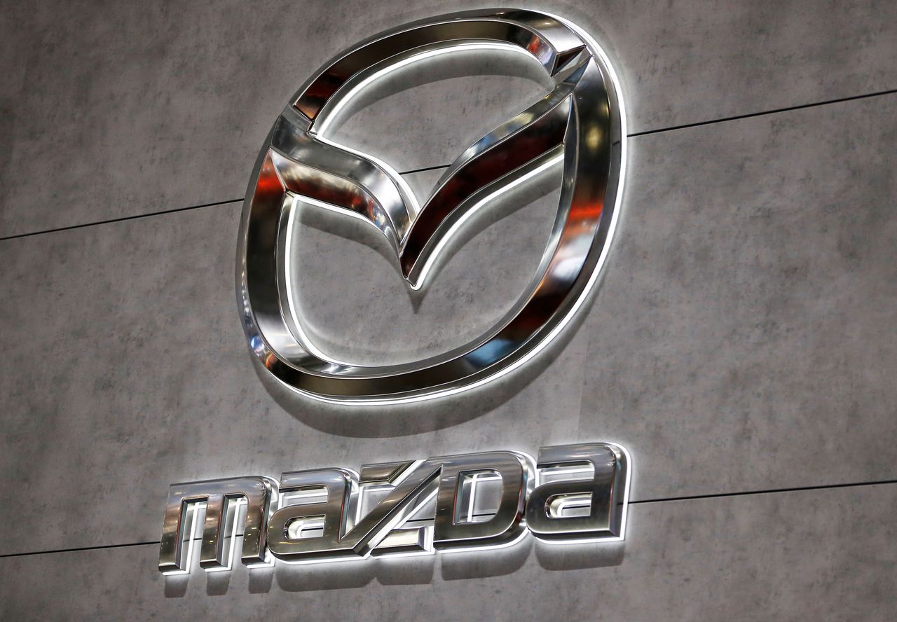 FILE PHOTO: A Mazda logo is displayed at the 89th Geneva International Motor Show in Geneva, Switzerland March 5, 2019. REUTERS/Pierre Albouy