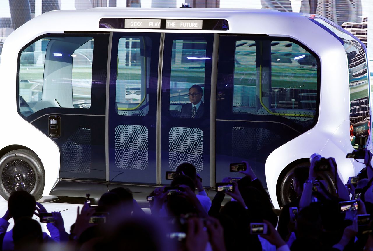 FILE PHOTO: Toyota Motor Corporation President Akio Toyoda, arrives in their e-Palette autonomous concept vehicle to give his presentation at the Tokyo Motor Show, in Tokyo, Japan October 23, 2019. REUTERS/Edgar Su