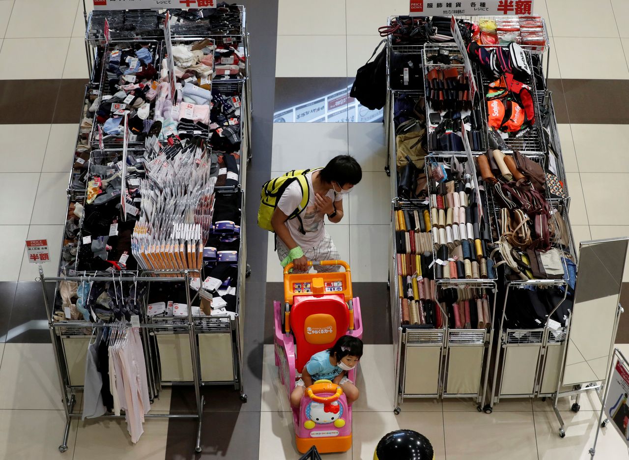 FILE PHOTO: A shopper looks at goods at Japan