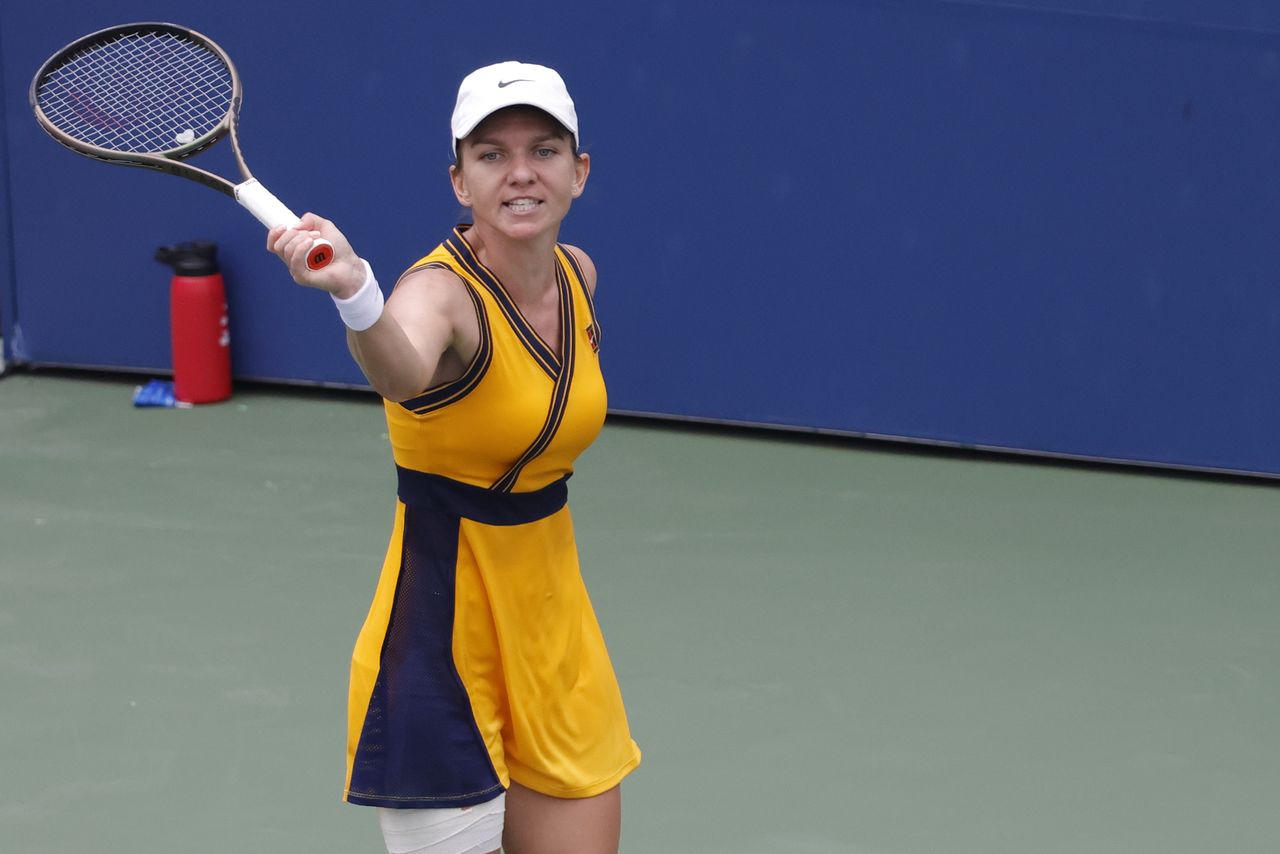 Aug 30, 2021; Flushing, NY, USA; Simona Halep (ROU) gestures to her player