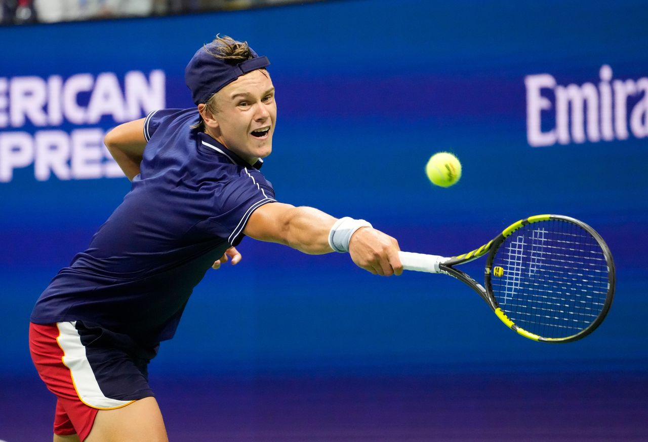 Aug 31, 2021; Flushing, NY, USA; Holger Vitus Nodskov Rune of Denmark hits to Novak Djokovic of Serbia on day two of the 2021 U.S. Open tennis tournament at USTA Billie Jean King National Tennis Center. Mandatory Credit: Robert Deutsch-USA TODAY Sports