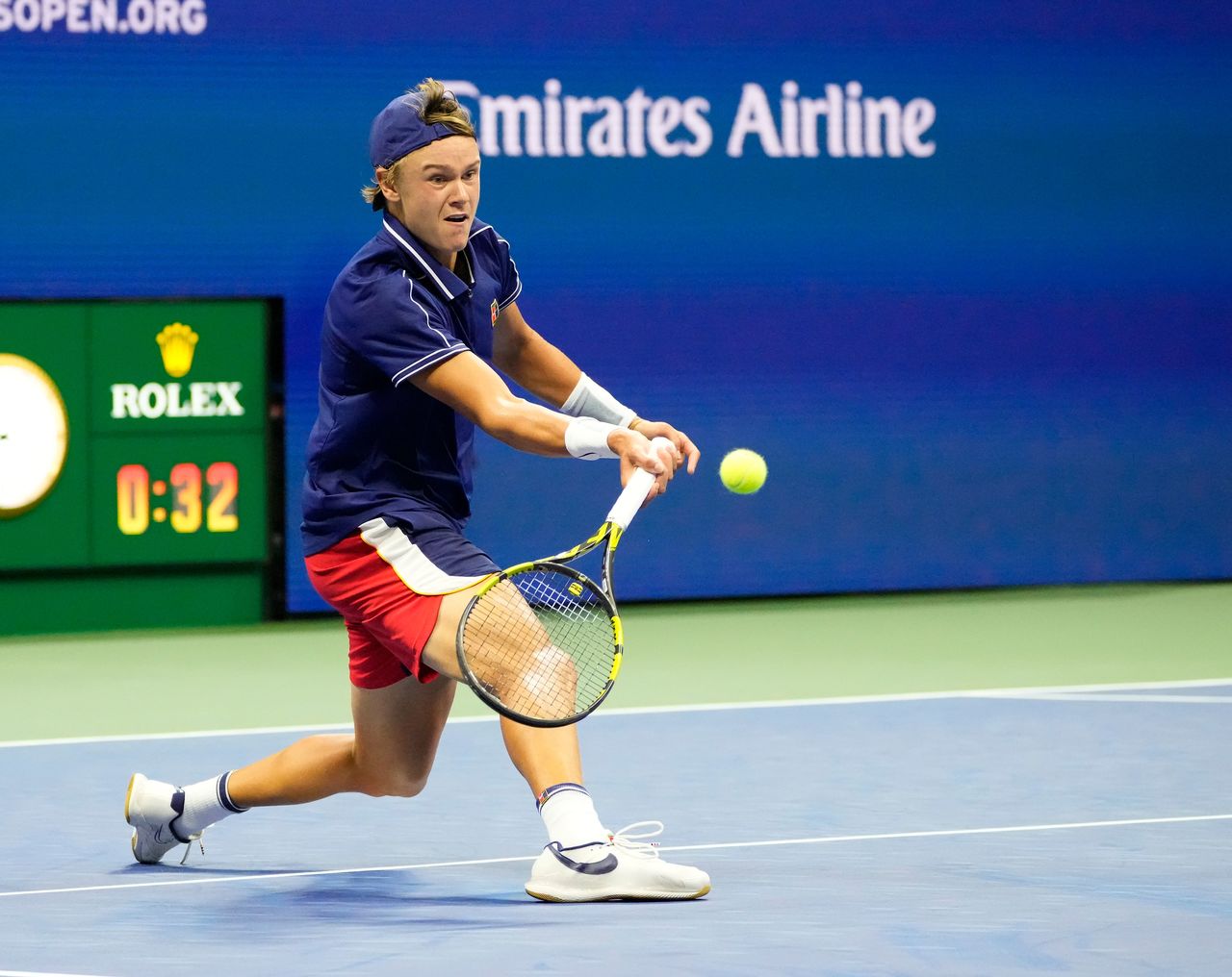 Aug 31, 2021; Flushing, NY, USA; Holger Vitus Nodskov Rune of Denmark hits to Novak Djokovic of Serbia on day two of the 2021 U.S. Open tennis tournament at USTA Billie Jean King National Tennis Center. Mandatory Credit: Robert Deutsch-USA TODAY Sports