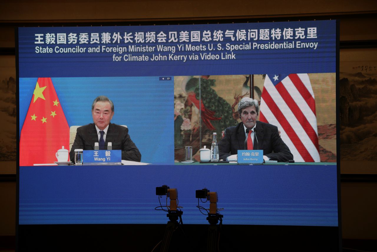 U.S. Special Presidential Envoy for Climate John Kerry is seen on a screen with Chinese State Councillor and Foreign Minister Wang Yi during a meeting via video link as Kerry visits Tianjin, China September 1, 2021. U.S. Department of State/Handout via REUTERS