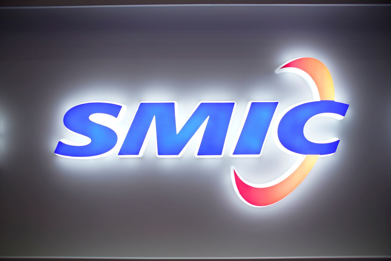 FILE PHOTO: A logo of Semiconductor Manufacturing International Corporation (SMIC) is seen at China International Semiconductor Expo (IC China 2020) in Shanghai, China October 14, 2020. REUTERS/Aly Song