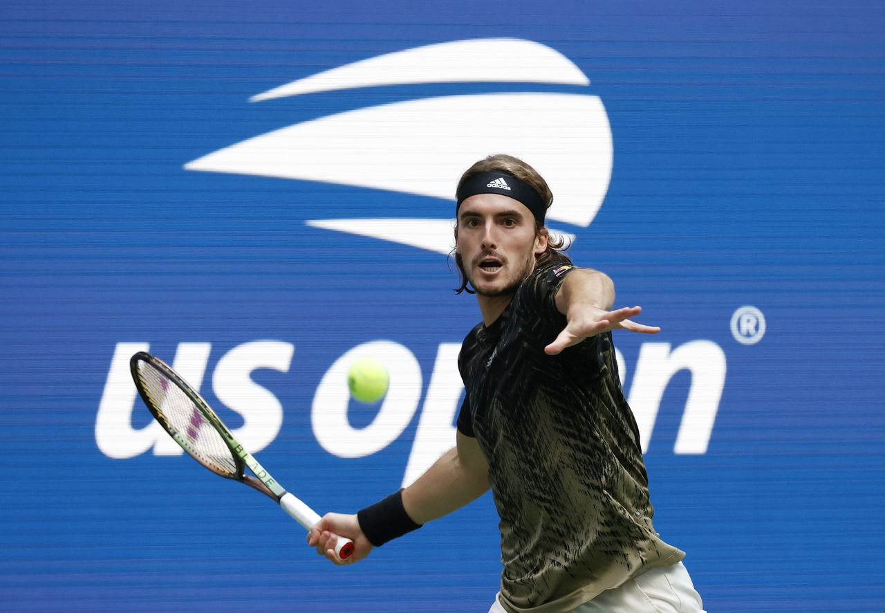 Sep 3, 2021; Flushing, NY, USA; Stefanos Tsitsipas of Greece hits a shot against Carlos Alcaraz of Spain in a third round match on day five of the 2021 U.S. Open tennis tournament at USTA Billie Jean King National Tennis Center. Mandatory Credit: Jerry Lai-USA TODAY Sports