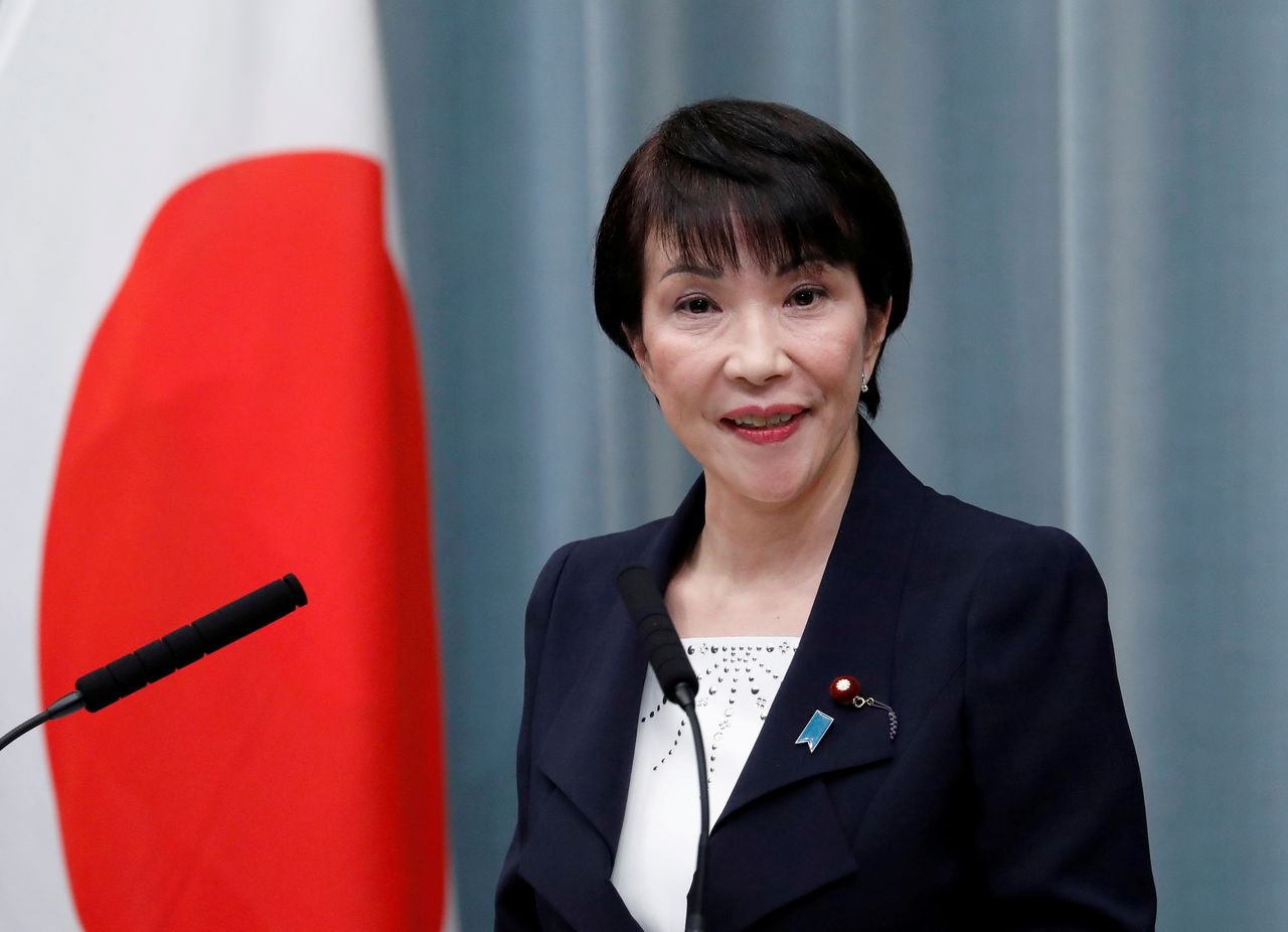 Japan's COVID vaccine minister favoured for PM; woman wins backing
