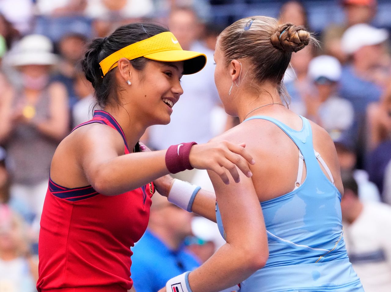 Sep 6, 2021; Flushing, NY, USA; Emma Raducanu of the United Kingdom (left) at the net after beating Shelby Rogers of the USA on day eight of the 2021 U.S. Open tennis tournament at USTA Billie Jean King National Tennis Center. Robert Deutsch-USA TODAY Sports