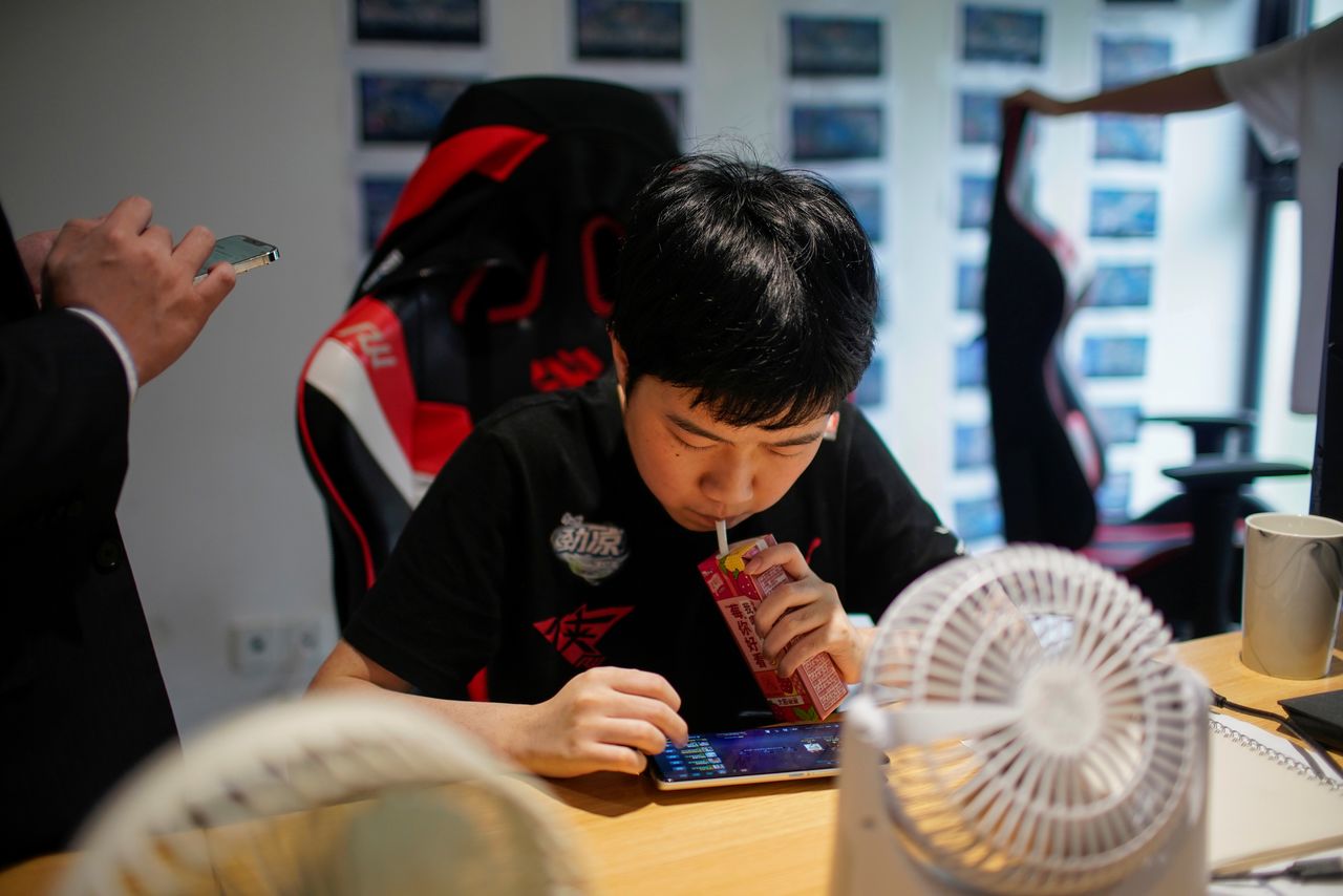 Peng Ahi, 21, player of Rogue Warriors esports team trains for the game "Arena of Valor" at his club in Shanghai, China September 3, 2021. Picture taken September 3, 2021. REUTERS/Aly Song