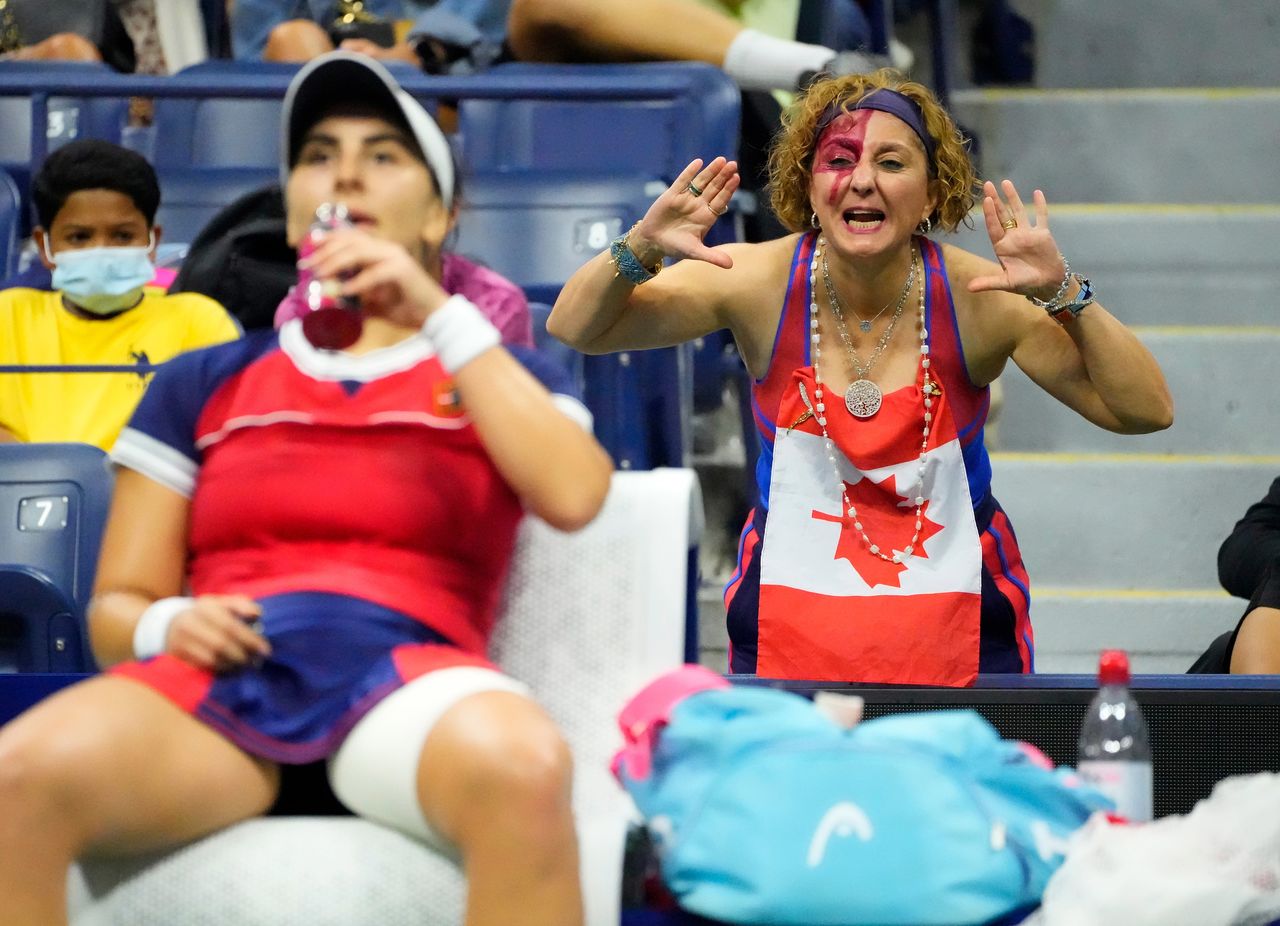 Sep 6, 2021; Flushing, NY, USA; Bianca Andreescu of Canada (left) takes a drink during a change as fans cheer her on in the third set against Maria Sakkari of Greece on day eight of the 2021 U.S. Open tennis tournament at USTA Billie Jean King National Tennis Center. Mandatory Credit: Robert Deutsch-USA TODAY Sports