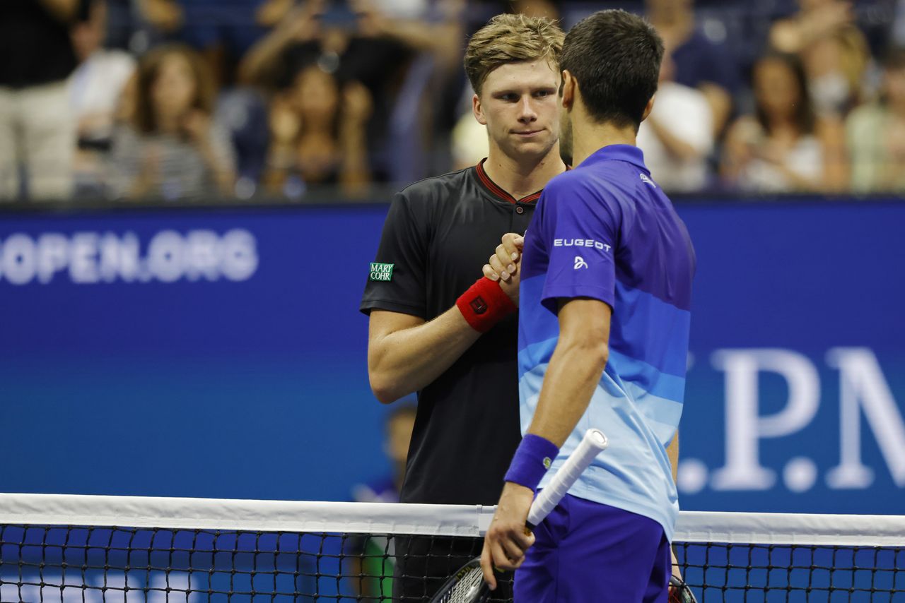 Sep 6, 2021; Flushing, NY, USA; Novak Djokovic of Serbia (R) shakes hands with Jenson Brooksby of the United States (L) after their match on day eight of the 2021 U.S. Open tennis tournament at USTA Billie Jean King National Tennis Center. Mandatory Credit: Geoff Burke-USA TODAY Sports