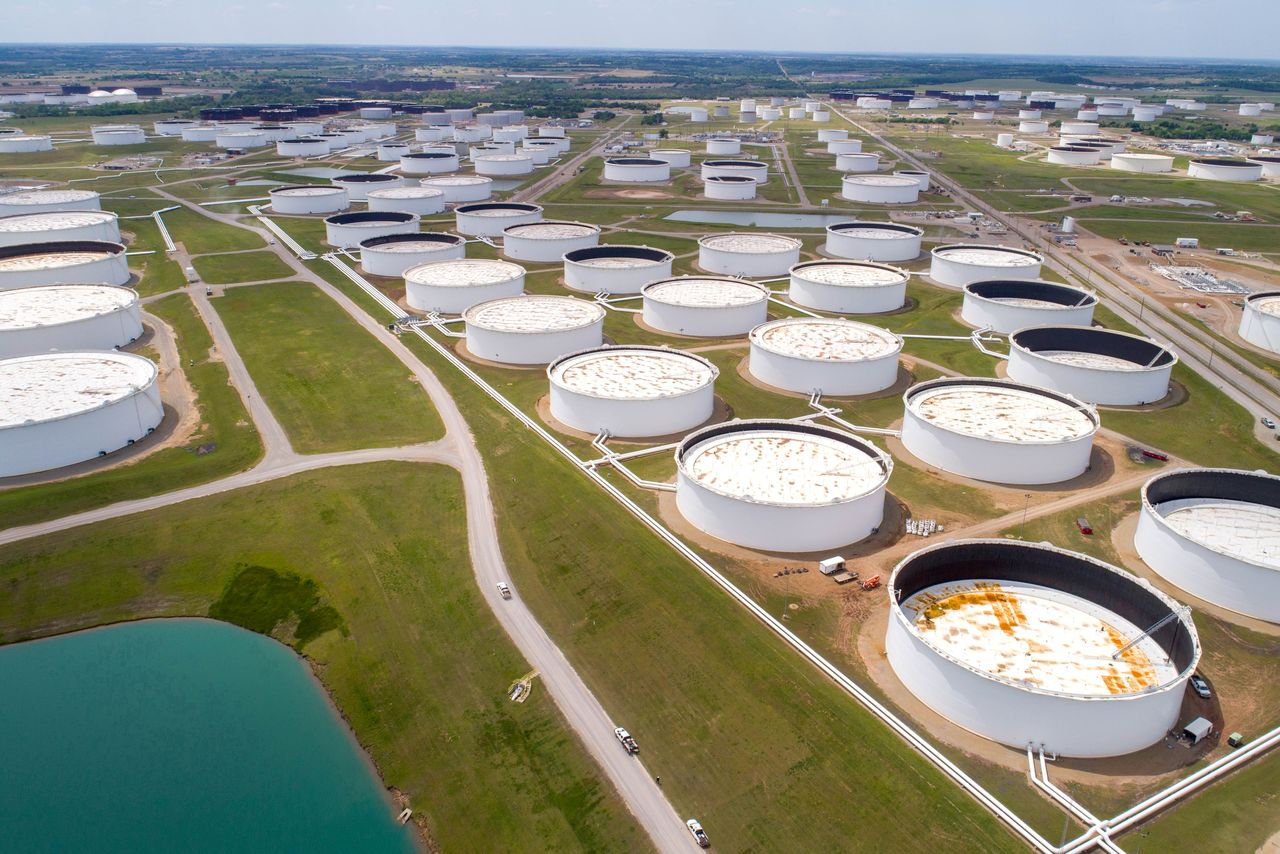 FILE PHOTO: Crude oil storage tanks are seen in an aerial photograph at the Cushing oil hub in Cushing, Oklahoma, U.S. April 21, 2020. REUTERS/Drone Base