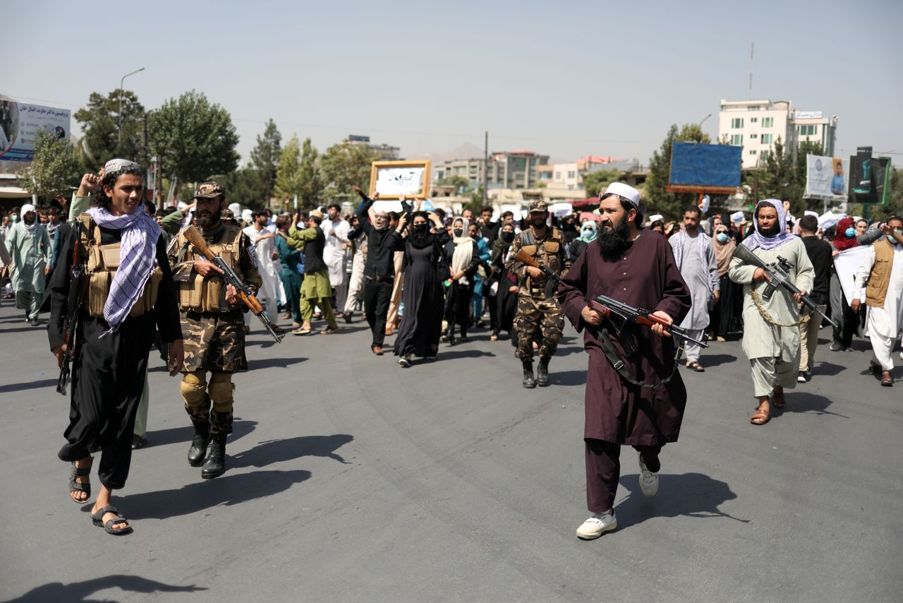 FILE PHOTO: Taliban soldiers stand in front of protesters during the anti-Pakistan protest in Kabul, Afghanistan, September 7, 2021. WANA (West Asia News Agency) via REUTERS