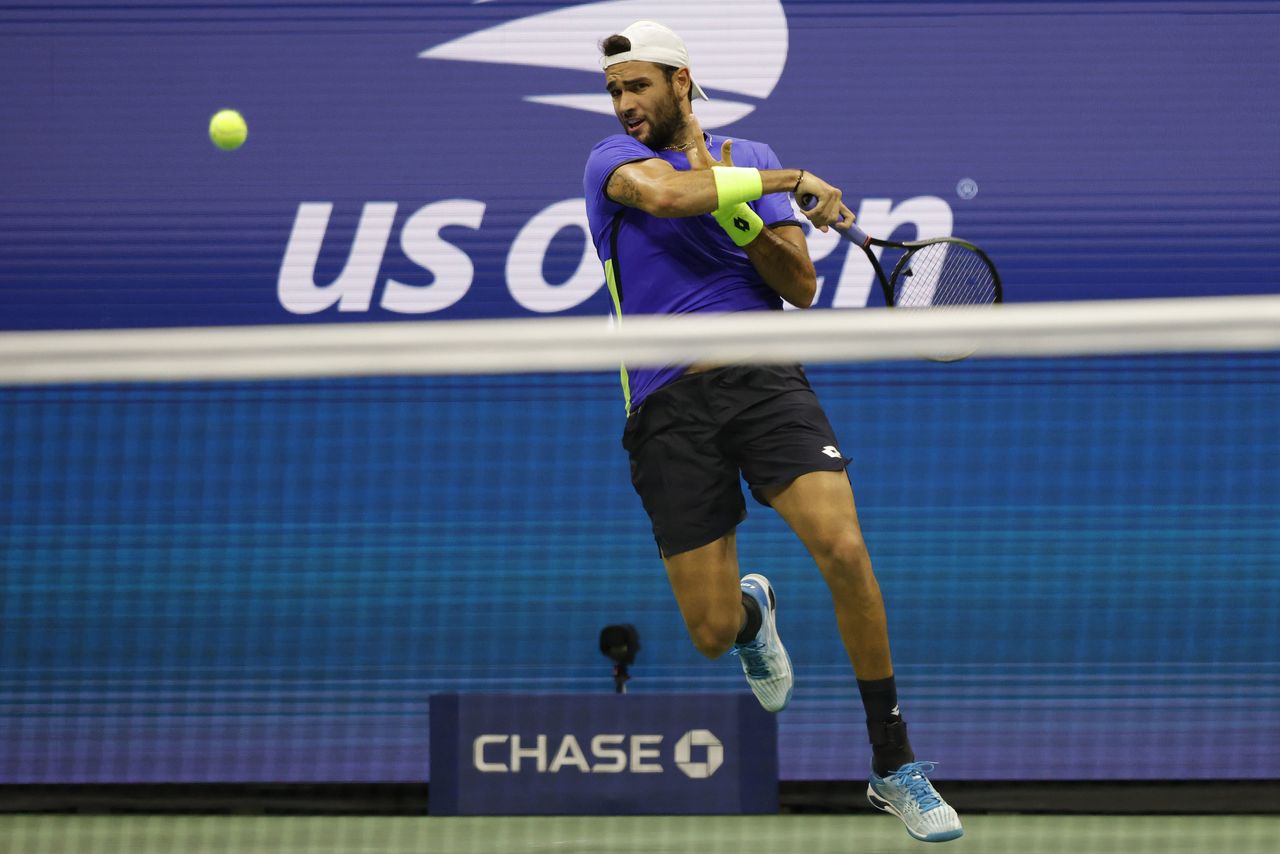 Sep 8, 2021; Flushing, NY, USA; Matteo Berrettini of Italy hits a forehand against Novak Djokovic of Serbia (not pictured) on day ten of the 2021 U.S. Open tennis tournament at USTA Billie Jean King National Tennis Center. Mandatory Credit: Geoff Burke-USA TODAY Sports