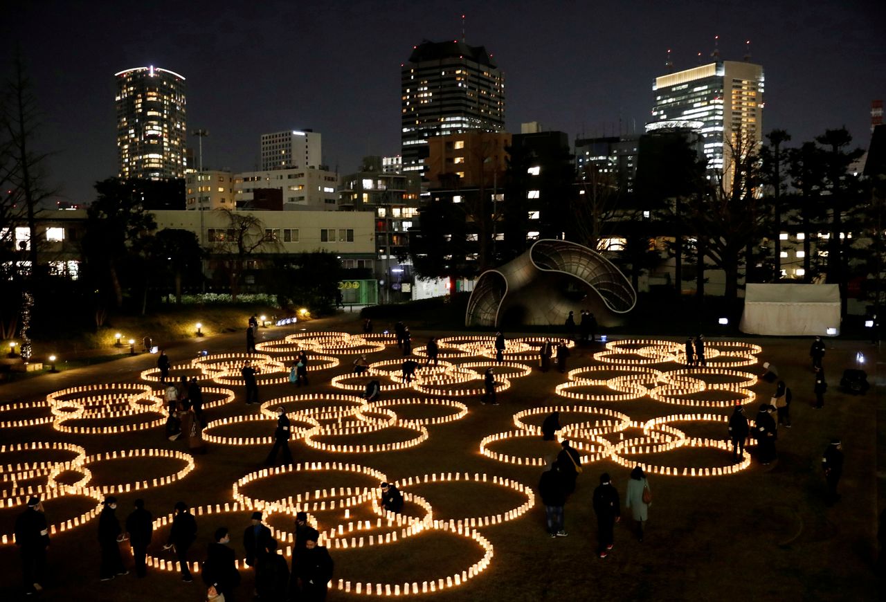 FILE PHOTO: Paper lanterns are lit for the victims of the March 11, 2011 earthquake and tsunami disaster that killed thousands and triggered the worst nuclear accident since Chernobyl, in Tokyo, Japan, March 11, 2021, to mark the10th anniversary of the disaster. REUTERS/Issei Kato/File Photo