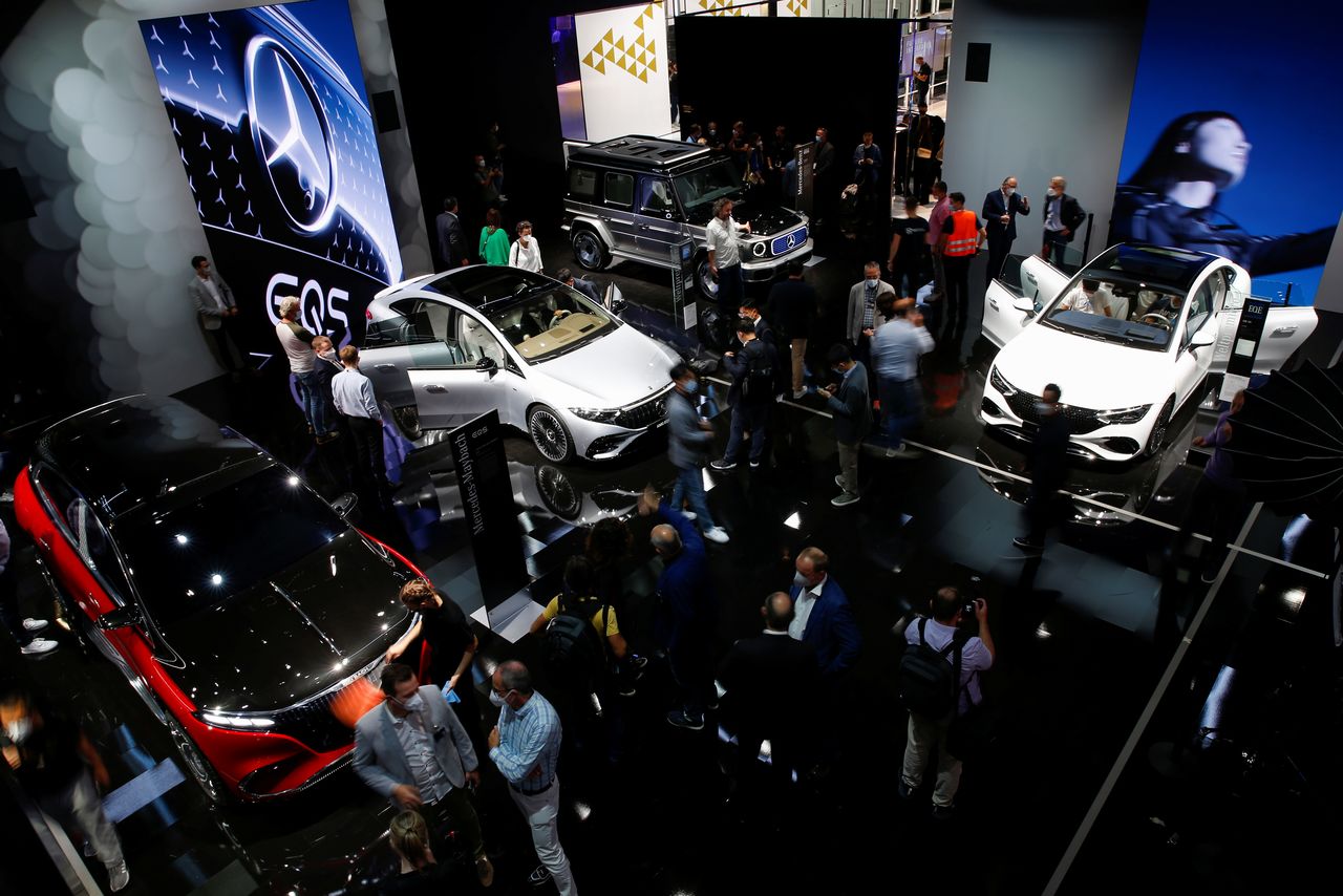 Visitors stand at Mercedes booth ahead of the Munich Motor Show IAA Mobility 2021 in Munich, Germany, September 6, 2021. REUTERS/Michaela Rehle