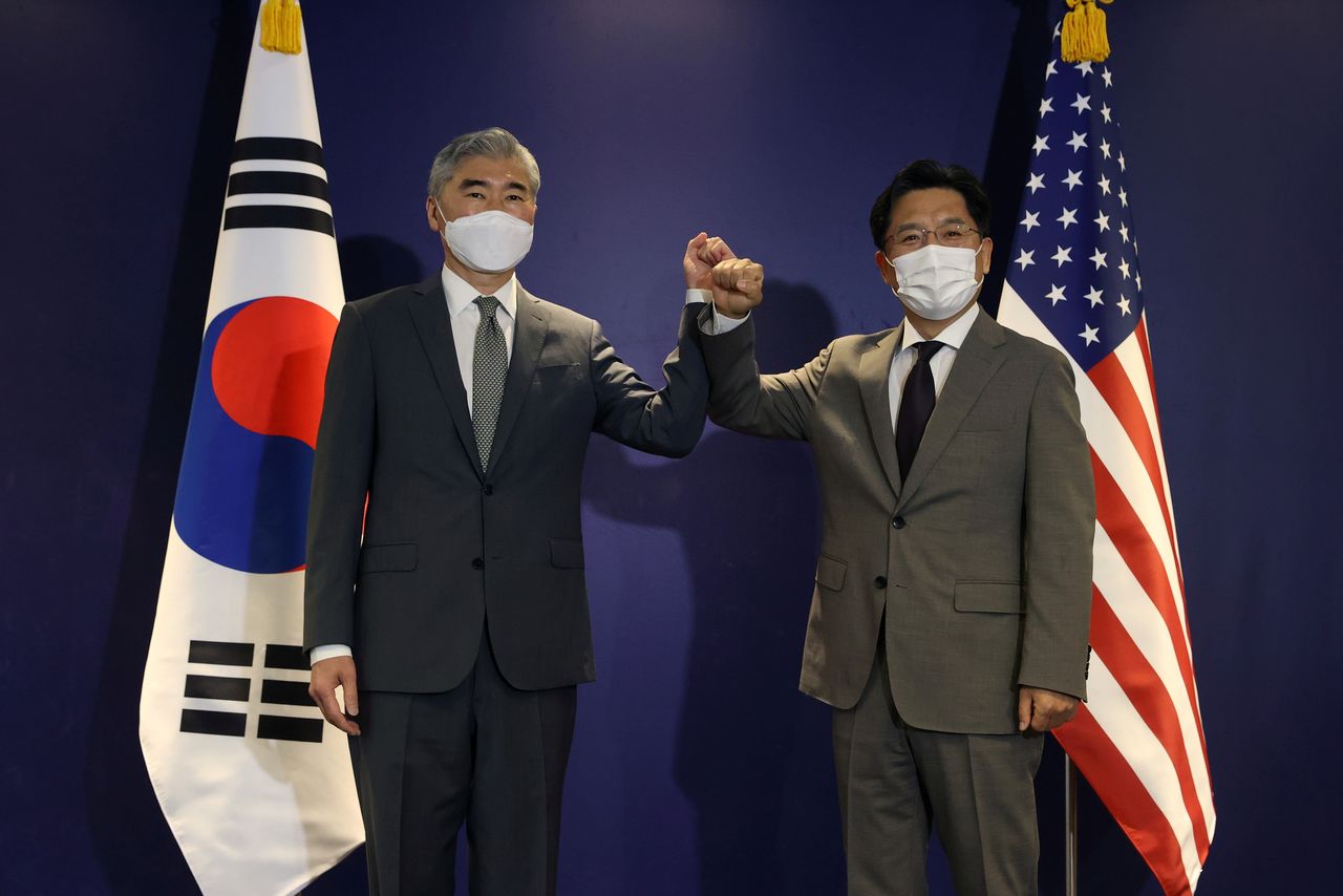 FILE PHOTO-U.S. Special Representative for North Korea, Sung Kim (L) bumps elbows with Noh Kyu-duk (R), South Korea