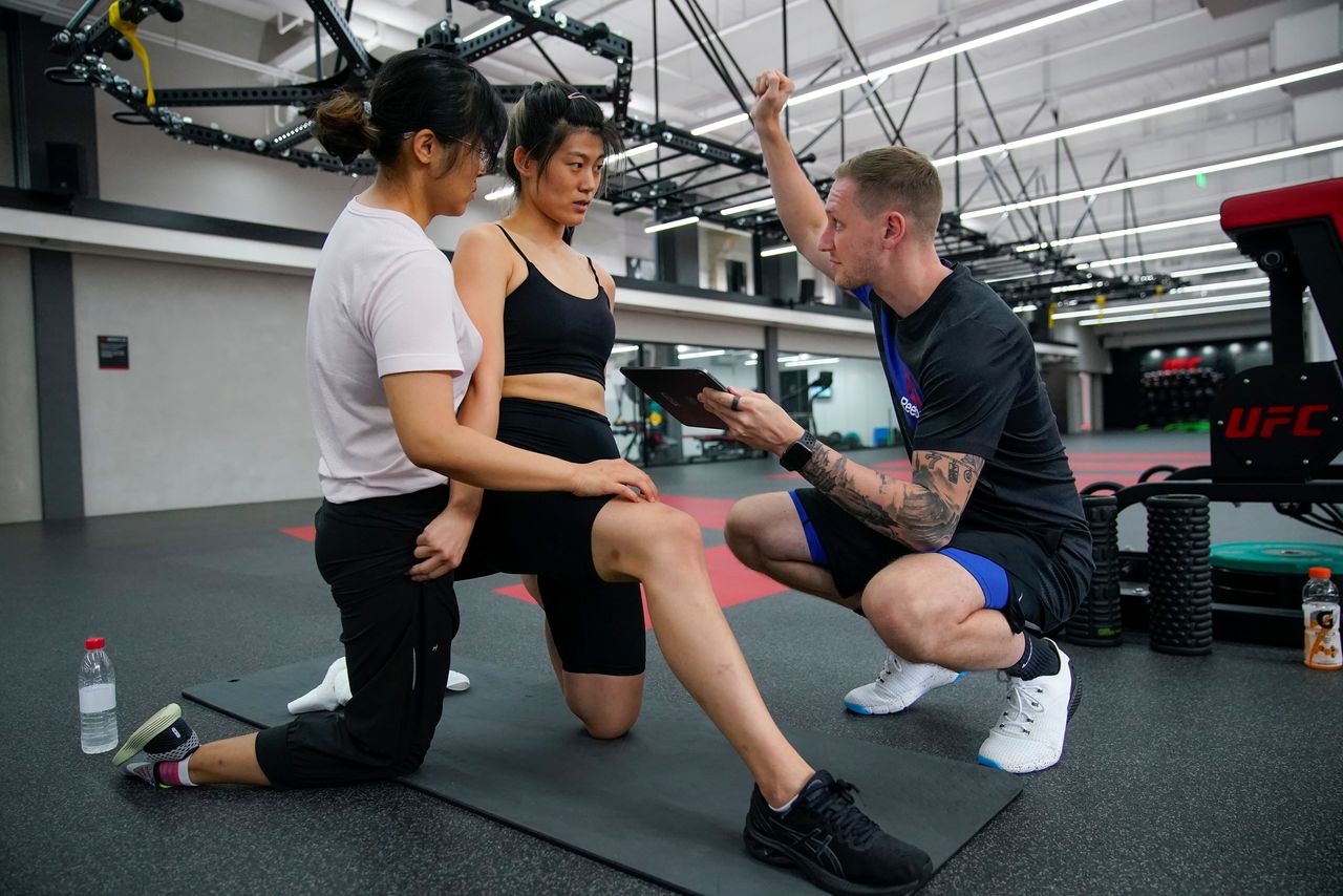 Chinese Olympic snowboarder Liu Jiayu trains with trainer Felix Falkenberg at the UFC Performance Institute in Shanghai, China September 10, 2021. REUTERS/Aly Song