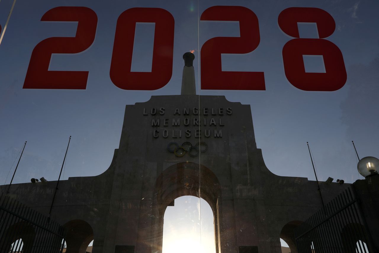 FILE PHOTO: An LA2028 sign is seen at the Los Angeles Coliseum to celebrate Los Angeles being awarded the 2028 Olympic Games, in Los Angeles, California, U.S., September 13, 2017. REUTERS/Lucy Nicholson