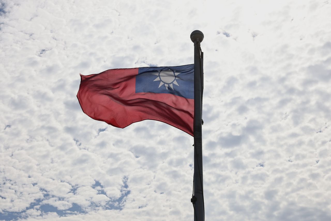 FILE PHOTO: A Taiwanese flag flaps in the wind in Taoyuan, Taiwan, June 30, 2021. REUTERS/Ann Wang