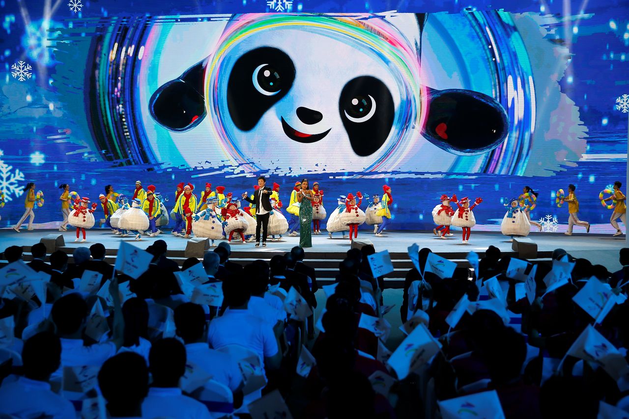 Singers perform on stage at a ceremony unveiling the slogan for Beijing 2022 Winter Olympics, in Beijing, China September 17, 2021. REUTERS/Tingshu Wang