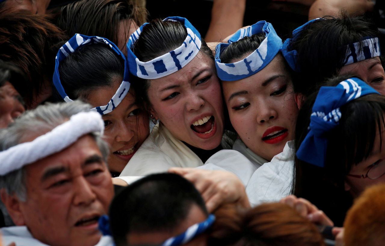 FILE PHOTO: Shrine parishioners carry a portable shrine into the Kanda Myojin Shrine during the Kanda festival, one of the three major Shinto festivals in Tokyo, Japan, May 14, 2017. REUTERS/Toru Hanai/File Photo