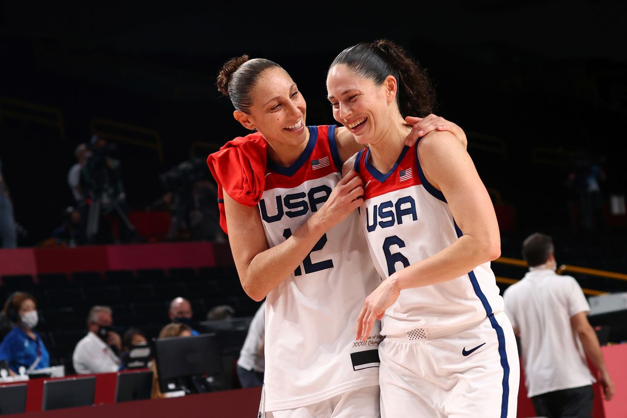 FILE PHOTO: Tokyo 2020 Olympics - Basketball - Women - Gold medal match - United States v Japan - Saitama Super Arena, Saitama, Japan - August 8, 2021. Sue Bird of the United States and Diana Taurasi of the United States celebrate after winning the gold medal match against Japan REUTERS/Brian Snyder/File Photo