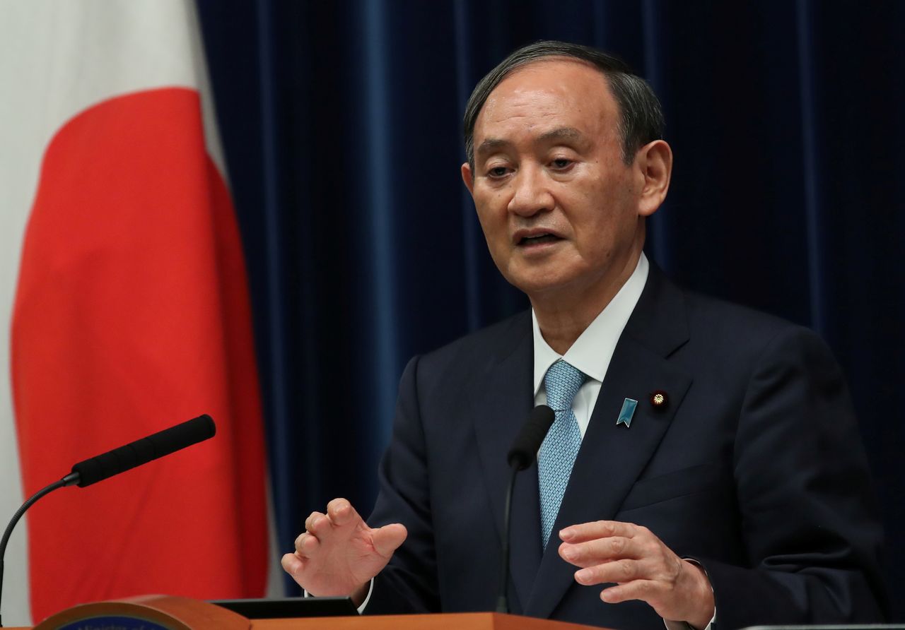 FILE PHOTO: Japanese Prime Minister Yoshihide Suga speaks at a news conference at his office in Tokyo, Japan, September 9, 2021. REUTERS/Kim Kyung-Hoon/Pool