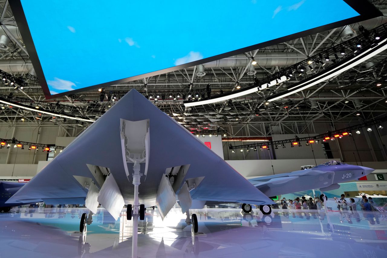 Models of GJ-11 stealth armed reconnaissance drone and J-20 stealth fighter jet are displayed at the China International Aviation and Aerospace Exhibition, or Airshow China, in Zhuhai, Guangdong province, China September 29, 2021. REUTERS/Aly Song