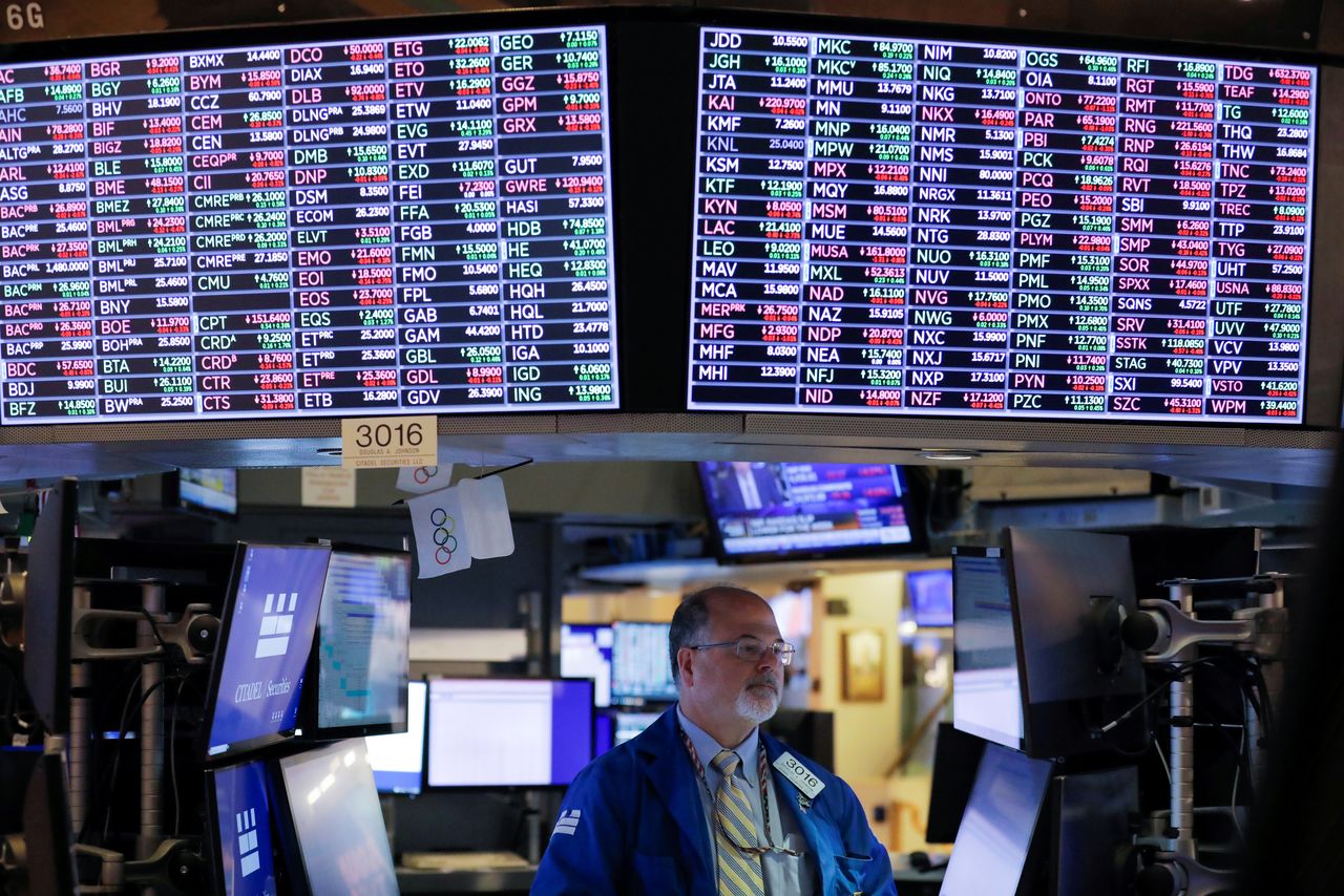 FILE PHOTO: A trader works on the floor at the New York Stock Exchange (NYSE) in Manhattan, New York City, U.S., September 24, 2021. REUTERS/Andrew Kelly