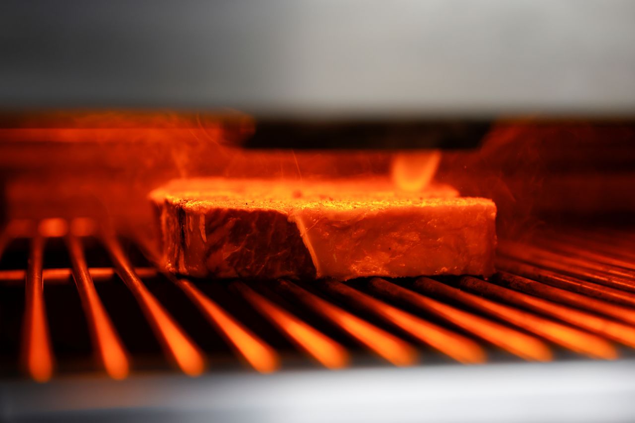 Beef steaks get cooked at the kitchen of Wolfgang