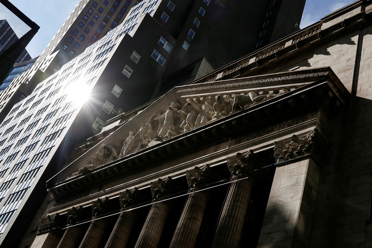 FILE PHOTO: The front facade of the New York Stock Exchange (NYSE) is seen in New York, U.S., February 16, 2021. REUTERS/Brendan McDermid