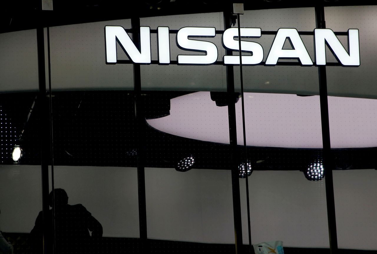 FILE PHOTO: A man is silhouetted at a show room of Nissan Motor Co. in Tokyo, Japan, February 12, 2019. REUTERS/Kim Kyung-hoon