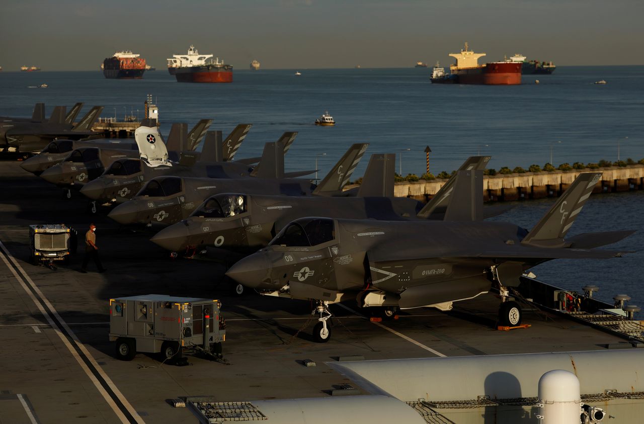 A row of Lockheed Martin F-35B Lightning II aircraft is seen onboard Britain’s HMS Queen Elizabeth aircraft carrier at Changi Naval Base in Singapore October 11, 2021. REUTERS/Edgar Su