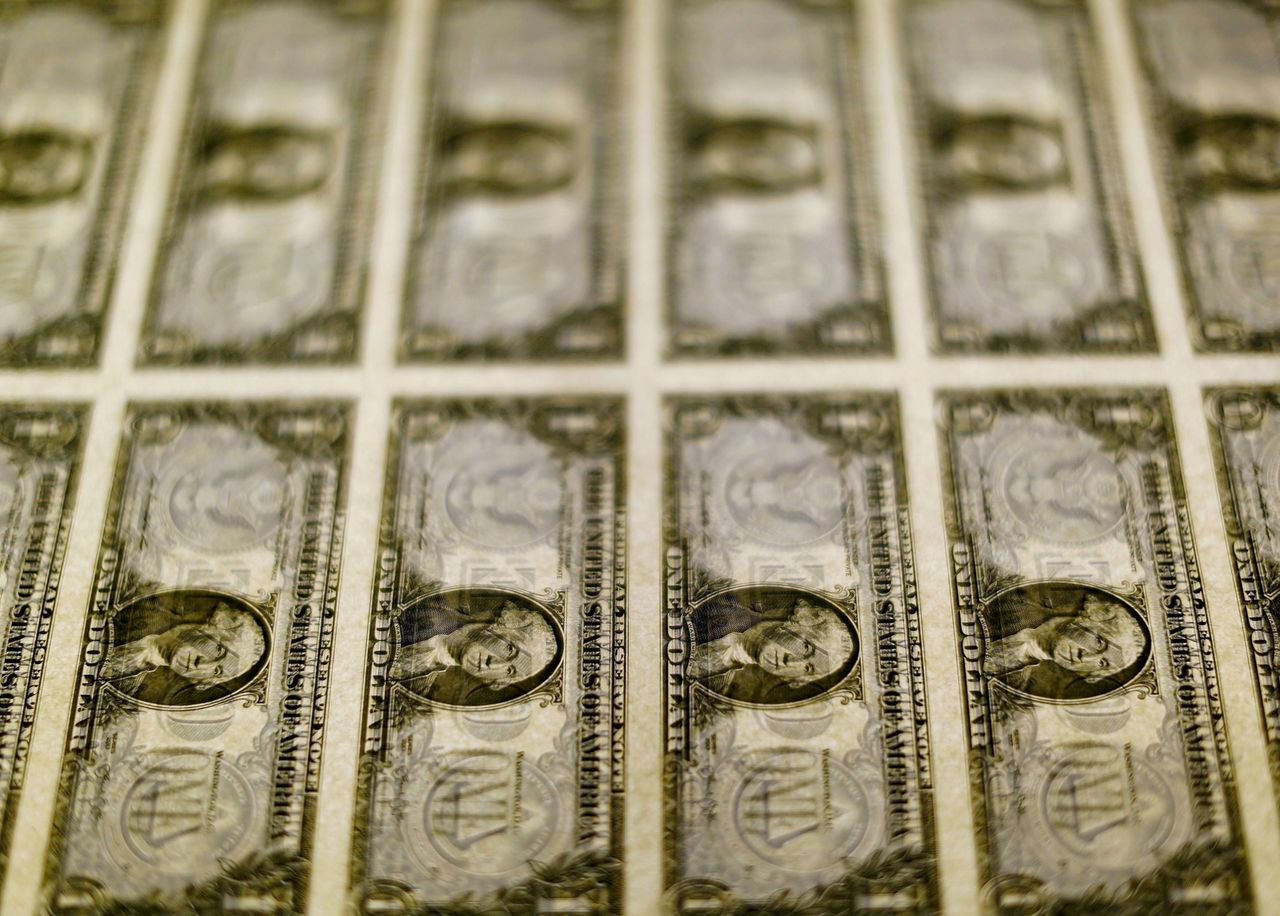 FILE PHOTO: U.S. dollar bills are seen on a light table at the Bureau of Engraving and Printing in Washington, November 14, 2014. REUTERS/Gary Cameron
