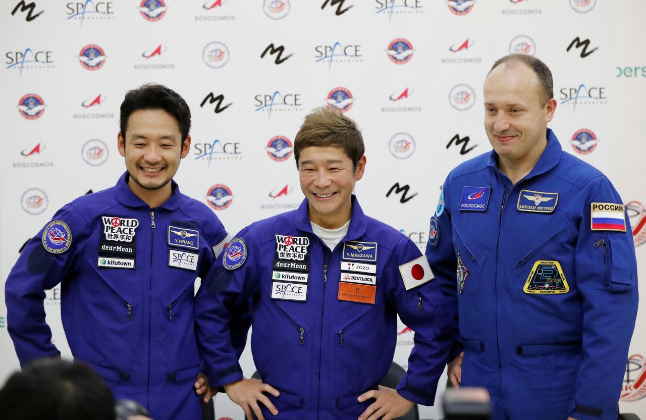 Roscosmos cosmonaut Alexander Misurkin and space flight participants Yusaku Maezawa and Yozo Hirano attend a news conference ahead of the expedition to the International Space Station, in Star City, Russia October 14, 2021. Japanese entrepreneur Yusaku Maezawa and his production assistant Yozo Hirano, led by Roscosmos cosmonaut Alexander Misurkin, will take part in a mission to the International Space Station (ISS) scheduled for December 8, 2021. REUTERS/Shamil Zhumatov/Pool