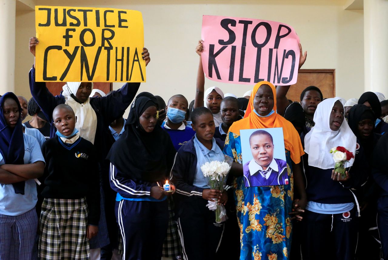 Teachers and students at the Kibera Girls School Soccer Academy (KGSA) gather after a memorial service for Cynthia Makokha (on the photograph), a teenage student who was raped and killed as she travelled home for school holidays, in Kibera district of Nairobi, Kenya October 15, 2021. REUTERS/Thomas Mukoya