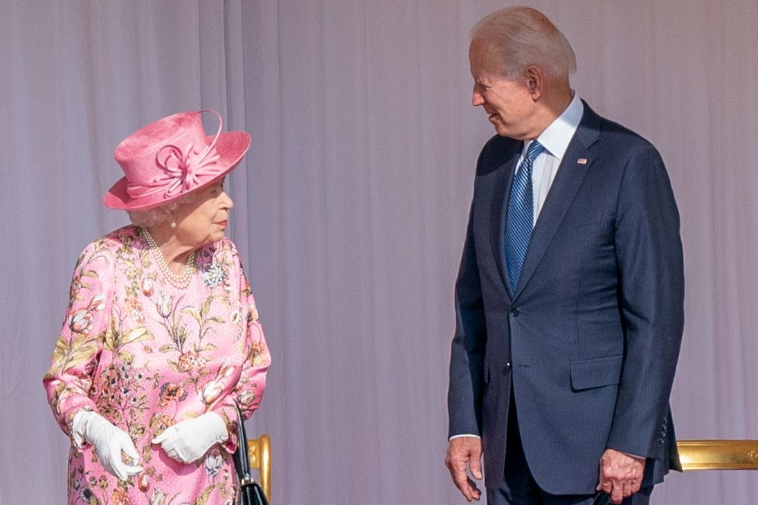 FILE PHOTO: U.S.President Joe Biden stands next to Britain