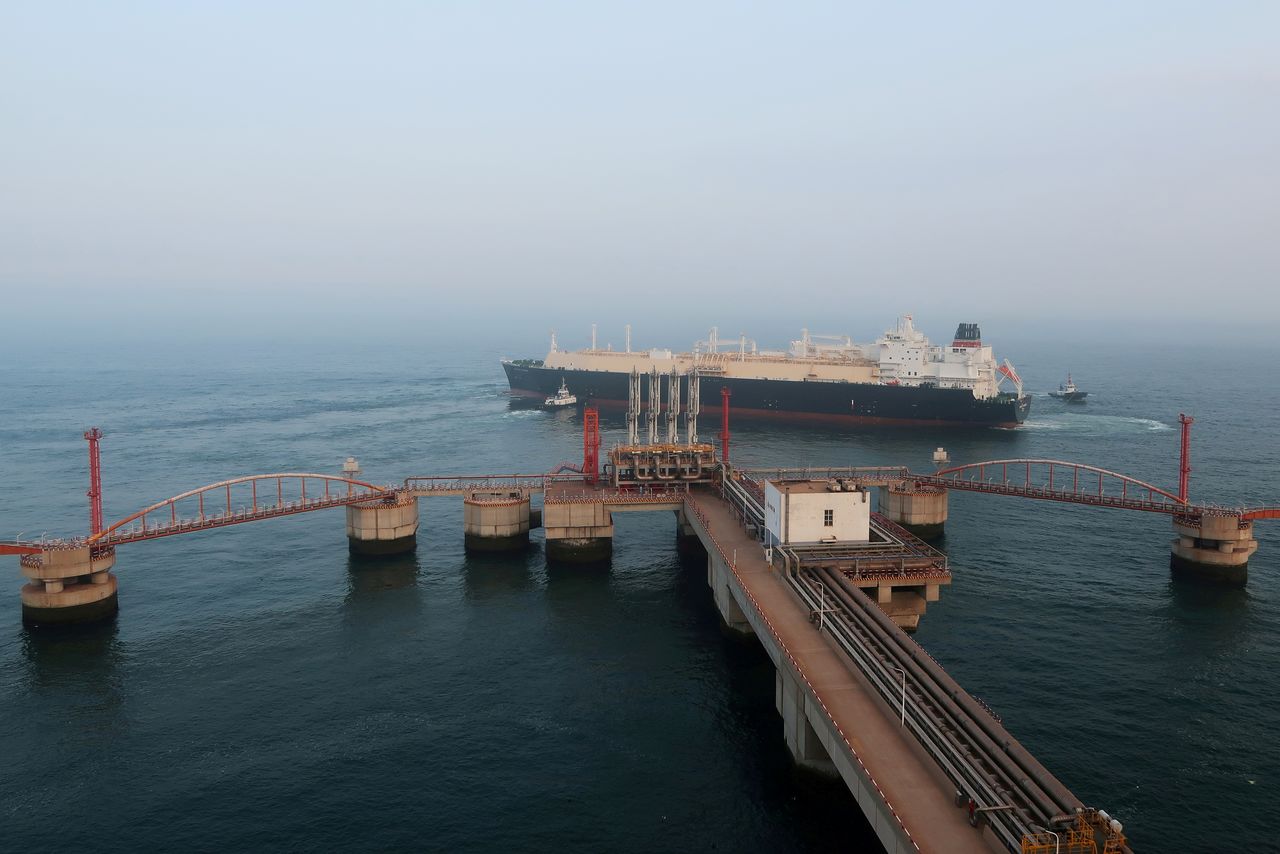 FILE PHOTO: A liquified natural gas (LNG) tanker leaves the dock after discharge at PetroChina