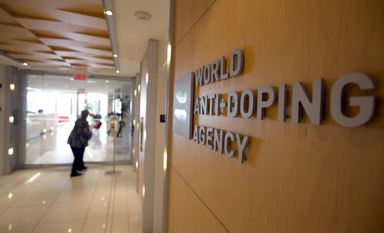 FILE PHOTO: A woman walks into the head office of the World Anti-Doping Agency (WADA) in Montreal, Quebec, Canada November 9, 2015.  REUTERS/Christinne Muschi