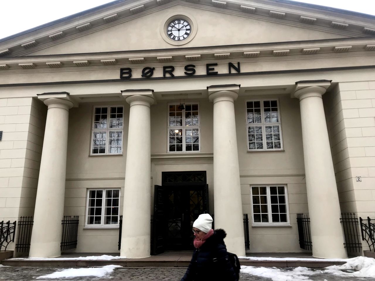FILE PHOTO: A woman walks past the Oslo Stock Exchange building in Oslo, Norway February 12, 2019. REUTERS/Gwladys Fouche