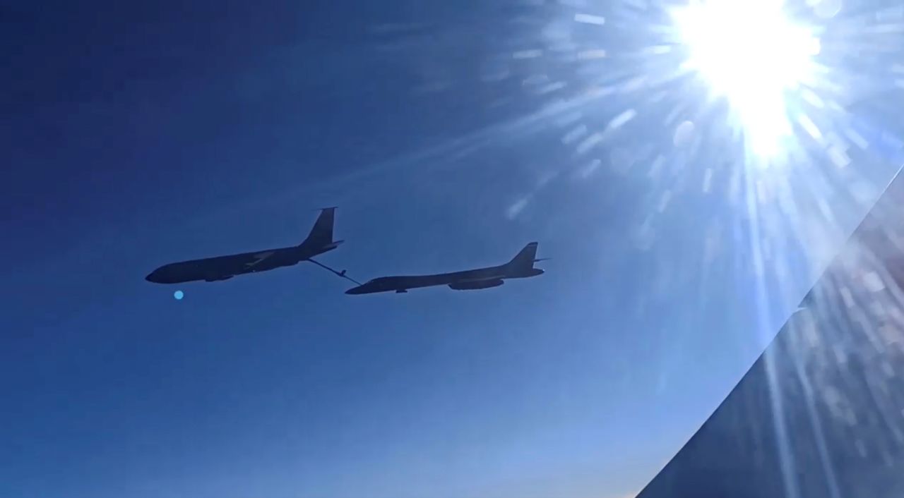 A view from a Russian Sukhoi Su-30 fighter jet shows, what the Russian Defence Ministry identified as a U.S. B-1B strategic bomber and KC-135 military refueling aircraft flying over the Black Sea, in this still image taken from video released on October 20, 2021. Russian Defence Ministry/Handout via REUTERS