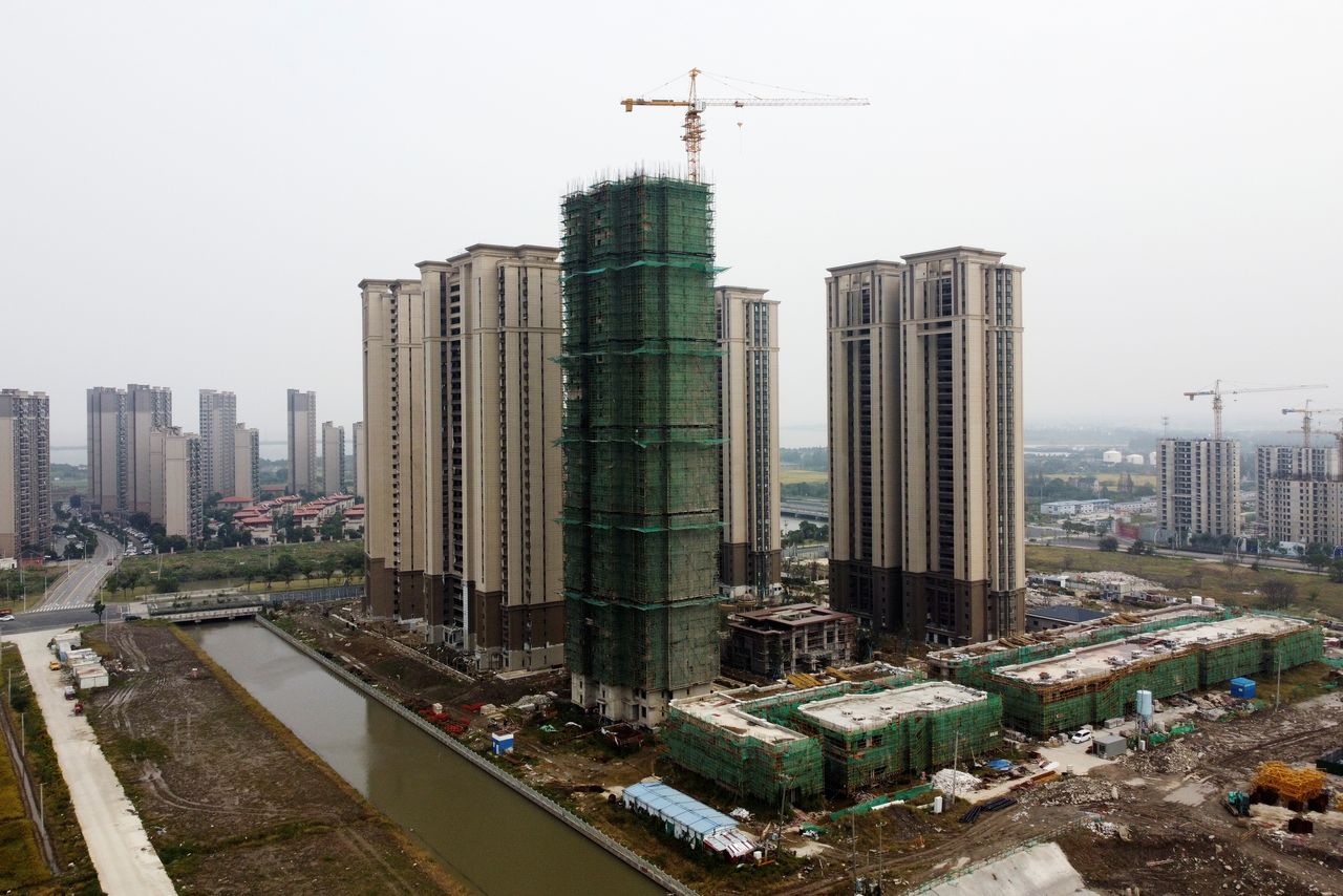 FILE PHOTO: An aerial view shows residential buildings at the construction site of Evergrande Cultural Tourism City, a China Evergrande Group project whose construction has halted, in Suzhou
