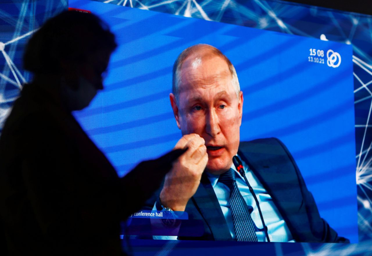 FILE PHOTO: Russian President Vladimir Putin is seen on a screen as he delivers a speech during a plenary session of the Russian Energy Week International Forum in Moscow, Russia October 13, 2021. REUTERS/Maxim Shemetov